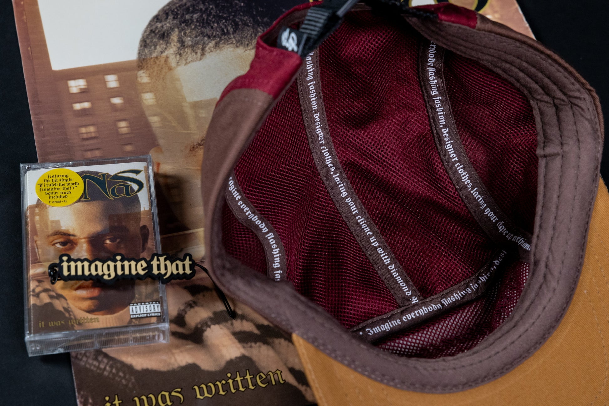 Inside of the "imagine that" 5ive Panel Hat with cassette and album cover of Nas' "It Was Written". Lyrics on the inside of hat. 