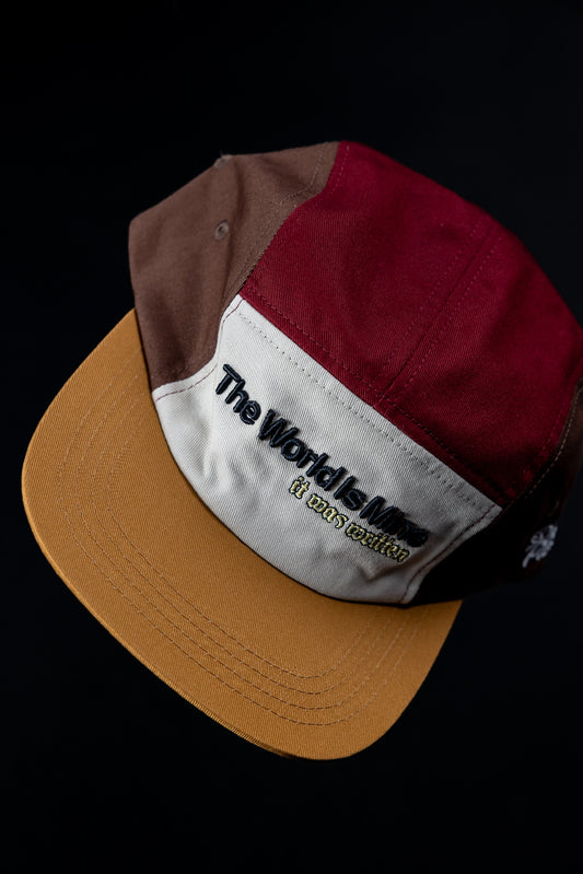 Brown, burgundy, and honey yellow "imagine that" 5ive Panel Hat with "The World Is Mine" on front