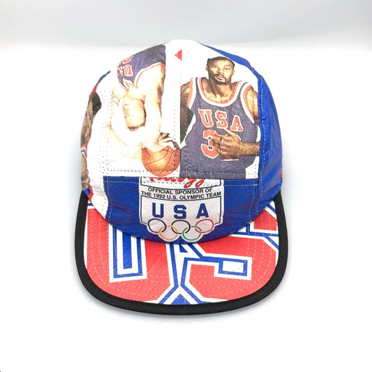 Red, white and blue 1992 Olympic 5 Panel Hat. Olympic USA logo on front panel, white background.