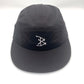 Black BAIT 5 Panel Hat with white bones logo on front panel, white background.
