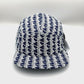Spinning blue and white Monogram Lacoste 5 Panel Hat, with white background.