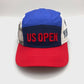 Spinning 2022 red, white and blue US Open 5 Panel Hat, embroidered logo on the front, with a white background.