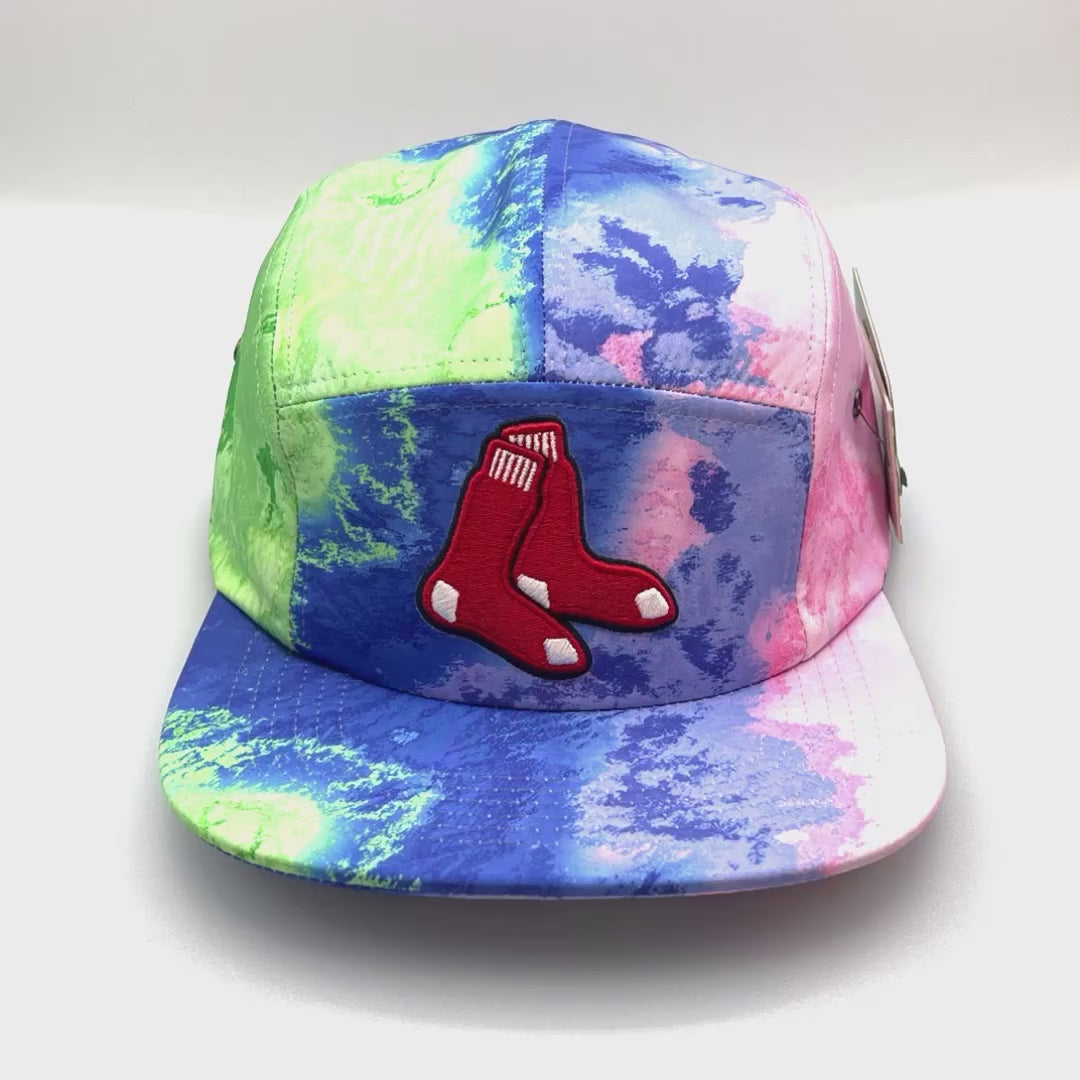 Spinning Multi colored tie dye MLB RedSox 5 Panel Hat, red sox logo on front, with white background.