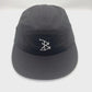 Spinning Black BAIT 5 Panel Hat with white bones logo on front panel, white background.